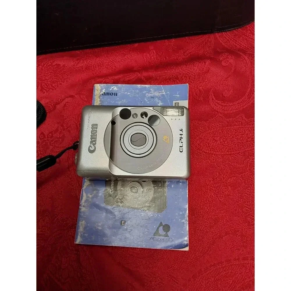 Camera by Canon model lX240 ELPH JR. Includes soft case working Film Camera